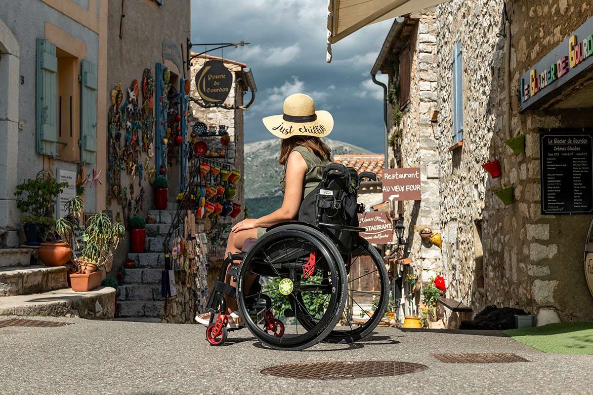 Woman in wheelchair with travel